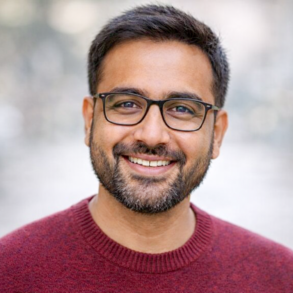 Rahul Verma, an Online MBA aspirant, wearing glasses and smiling confidently in a professional headshot